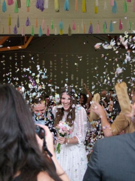 Happy bride amidst confetti-800